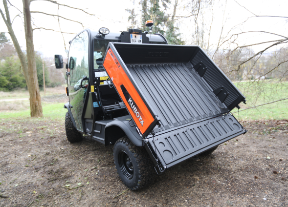 Kubota RTV X1110 orange 2 seater cabin from back cargo bed tilted