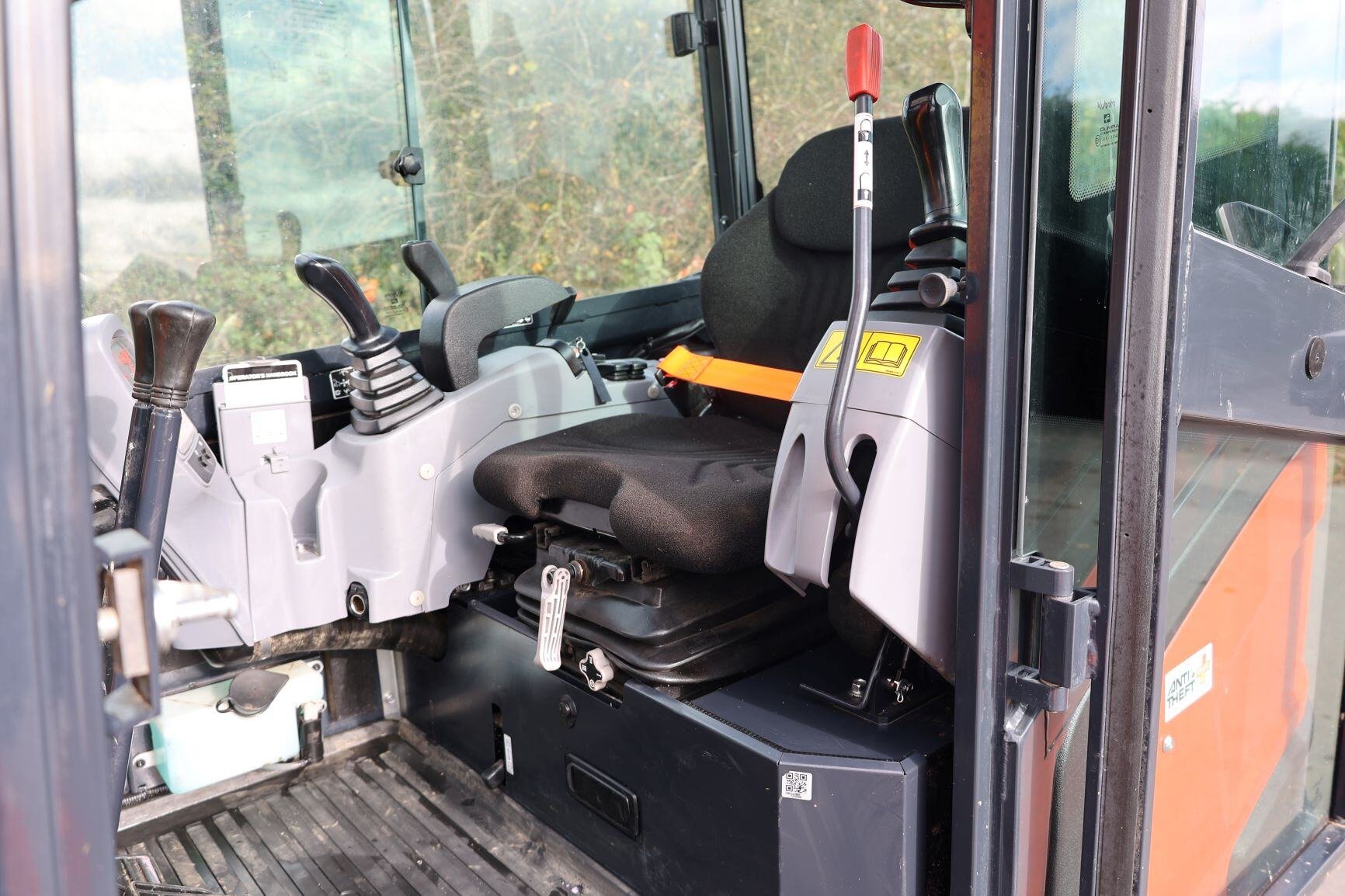 Inside cabin Kubota KX027 